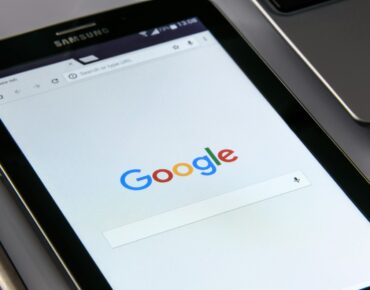 Google on mobile phone showing web design
