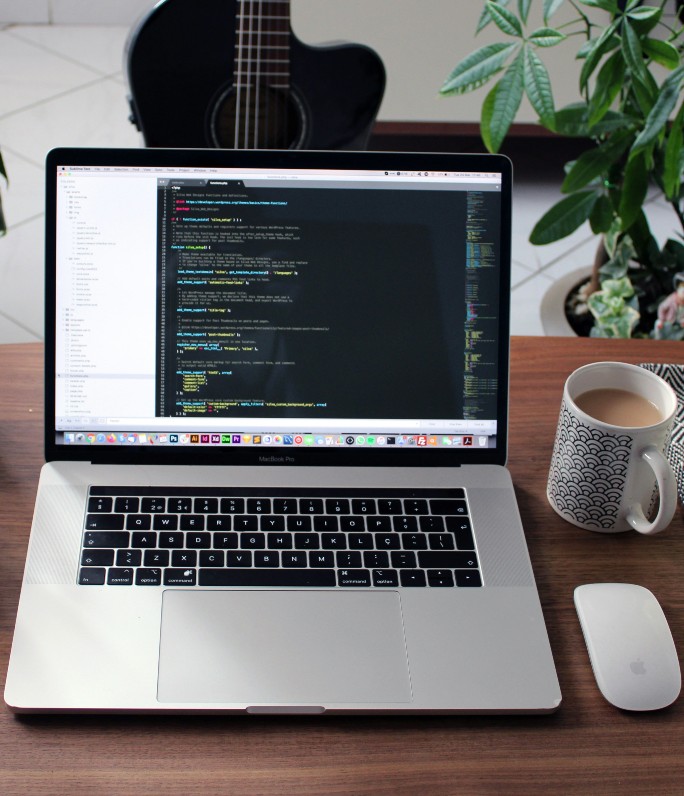 Web development laptop showing code.