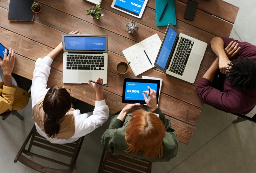 Web developers working on desk. Web design and seo agency
