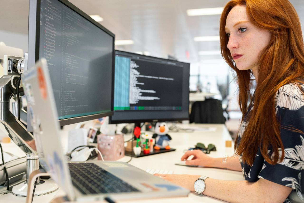 White lady doing web development at work